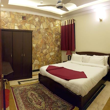 Triple One Hotel Suites Абботтабад Экстерьер фото