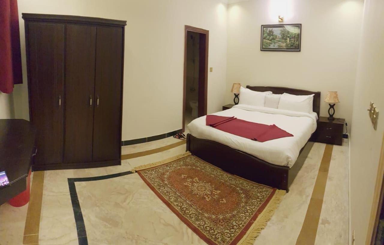 Triple One Hotel Suites Абботтабад Экстерьер фото